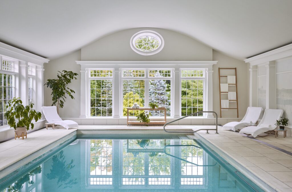 The indoor pool at the Mayflower Inn, one of the top luxury wellness hotels in Connecticut.