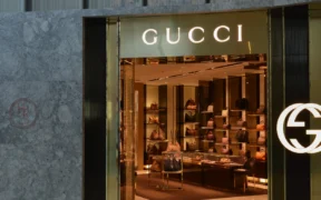 Gucci boutique entrance at Yorkdale Mall, with illuminated Gucci signage and handbags displayed inside.