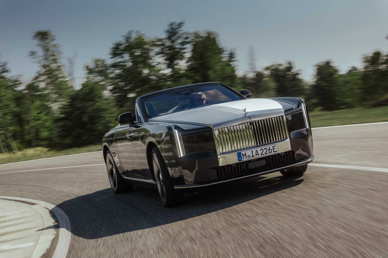 Front three-quarter view of the Rolls-Royce Project Nightingale prototype driving during testing.