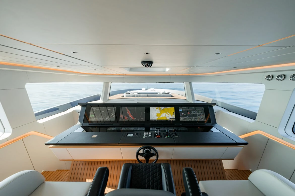 BRABUS AB110 helm with panoramic windows, digital navigation displays, black steering wheel and quilted captain’s seat.