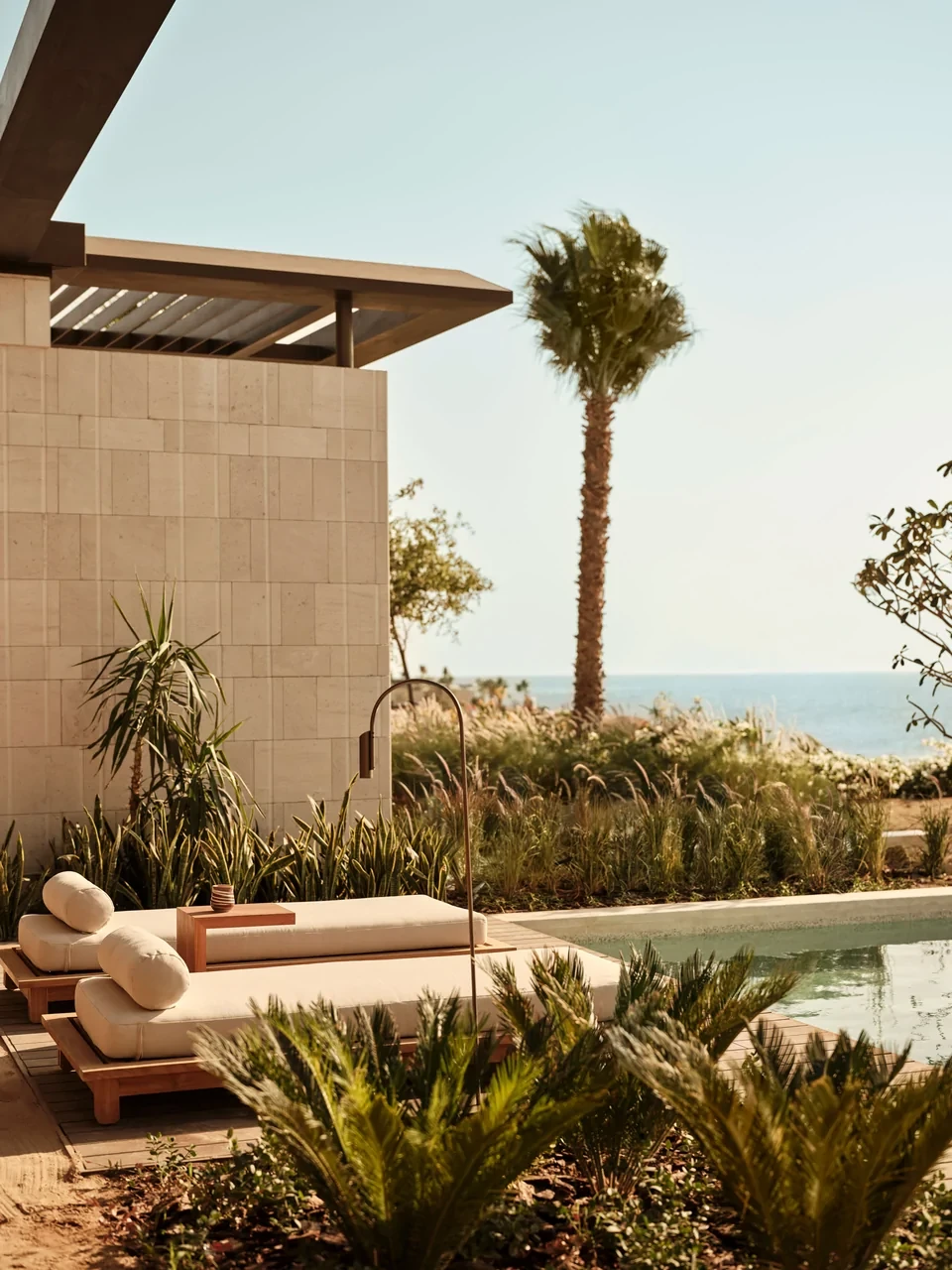 Private pool and sun terrace at a Sea Front Private Pool Suite at Rosewood AMAALA, with the Red Sea beyond.