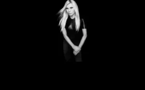 Donatella Versace in the official imagery released with her 2026 joint-venture announcement with REVOLVE.