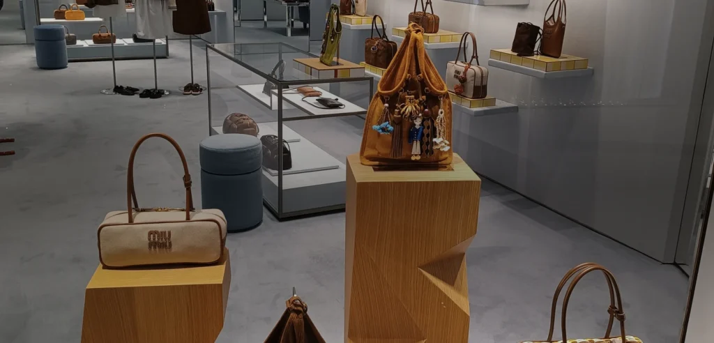Miu Miu handbags and apparel displayed inside the brand’s Elements boutique in Hong Kong in May 2025.