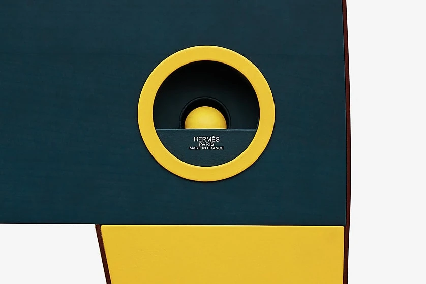 Hermès foosball table showing leather detailing and painted jockey figures.