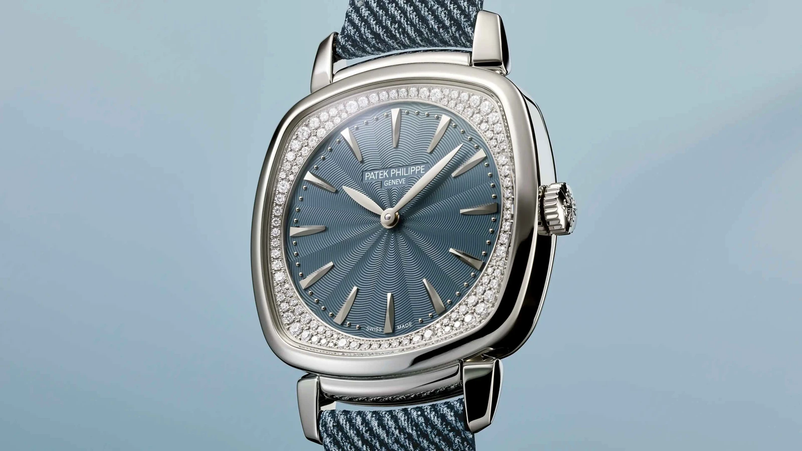 Patek Philippe Gondolo Ladies First 7043G-001 in white gold with blue-gray textured dial and a diamond-set flange, the $37,510 standard tier.